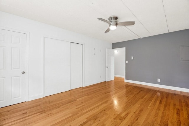 153 Milk St Unit 4, Westborough, MA 01581 - unfurnished bedroom with light wood-style floors, baseboards, a ceiling fan, and a closet