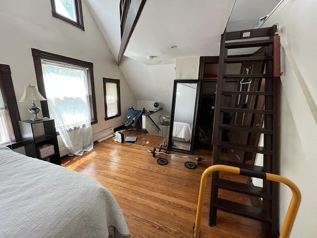 5-7 Prescott Pl, Boston, MA 02134 - bedroom featuring vaulted ceiling, wood finished floors, and a baseboard radiator