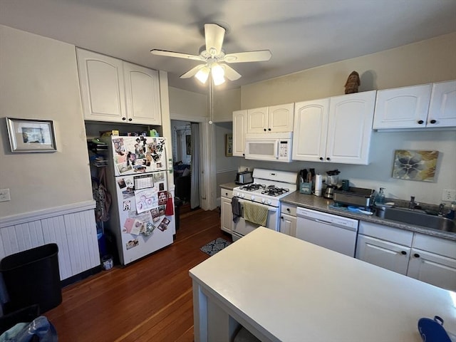 5-7 Prescott Pl, Boston, MA 02134 - kitchen with white appliances, radiator, dark wood-style flooring, and white cabinetry