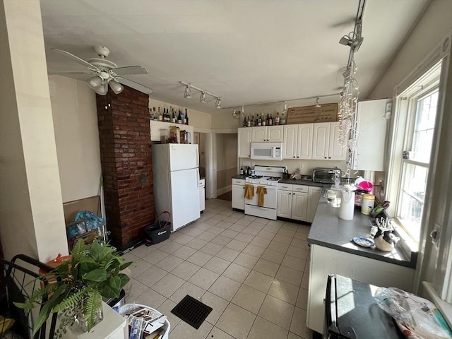 5-7 Prescott Pl, Boston, MA 02134 - kitchen featuring white appliances, track lighting, dark countertops, light tile patterned flooring, and a ceiling fan