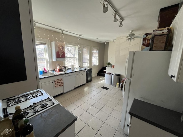 5-7 Prescott Pl, Boston, MA 02134 - kitchen featuring white appliances, light tile patterned floors, ceiling fan, track lighting, and white cabinets