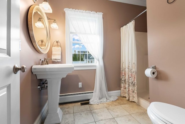 bathroom with tile patterned flooring, curtained shower, and toilet