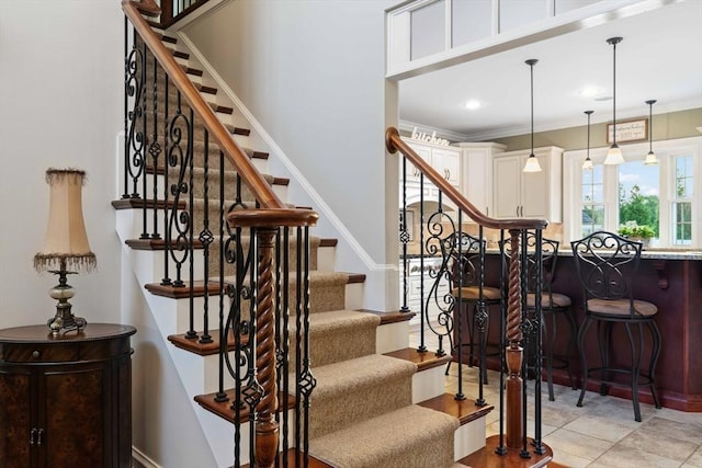 staircase with crown molding