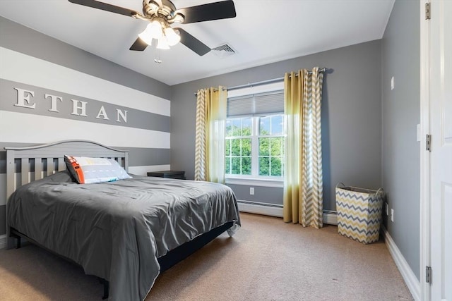 bedroom with a baseboard heating unit, ceiling fan, and carpet