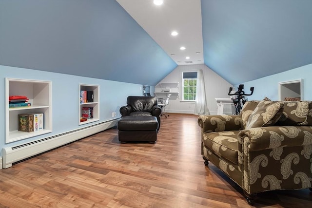 living area with baseboard heating, vaulted ceiling, built in features, and light wood-type flooring