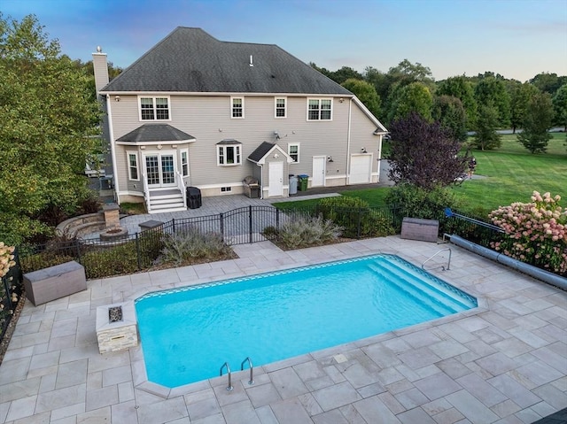 view of pool with a yard and a patio