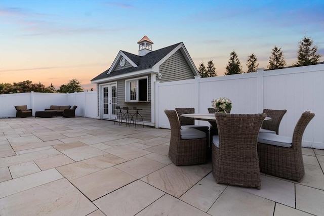 patio terrace at dusk with french doors