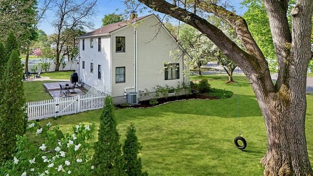 view of property exterior featuring central air condition unit and a patio