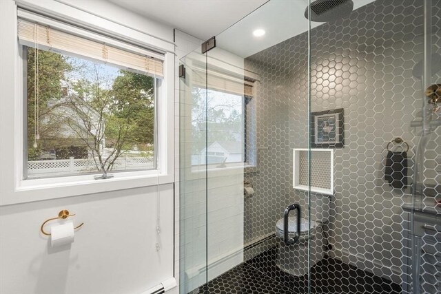 bathroom with a stall shower, recessed lighting, and tile patterned flooring