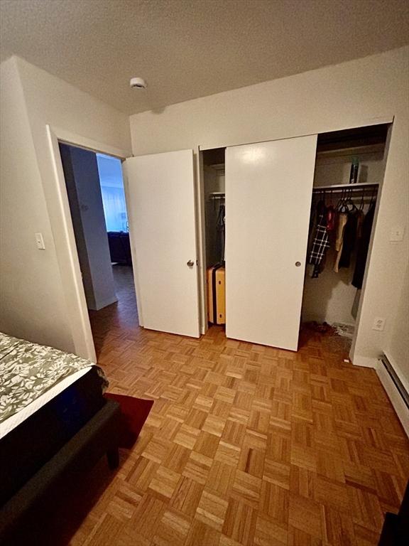 bedroom with a closet and a textured ceiling