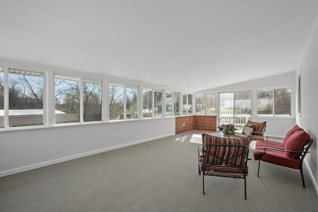 sunroom / solarium featuring lofted ceiling