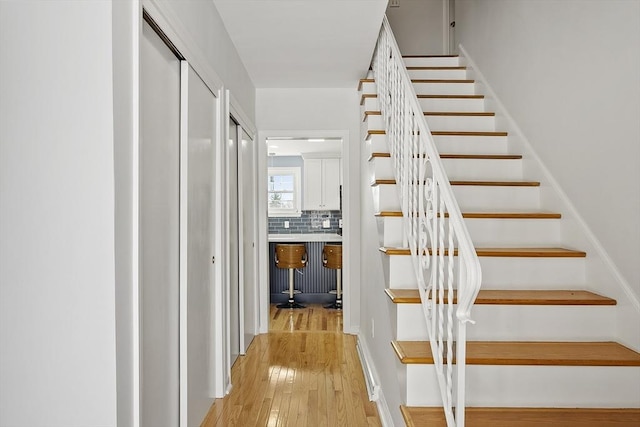 staircase featuring hardwood / wood-style floors