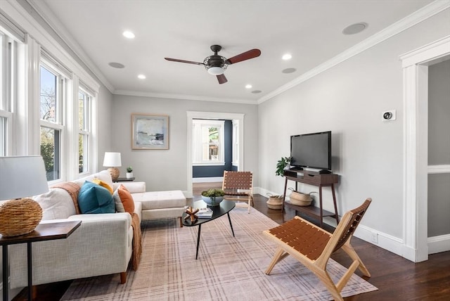 living room featuring a ceiling fan, baseboards, recessed lighting, and wood finished floors