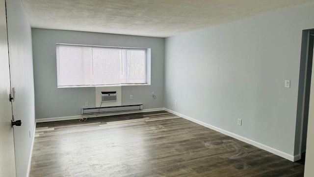 137 Winthrop St Unit 14A, Framingham, MA 01702 - spare room featuring a baseboard heating unit, wood finished floors, baseboards, and a textured ceiling