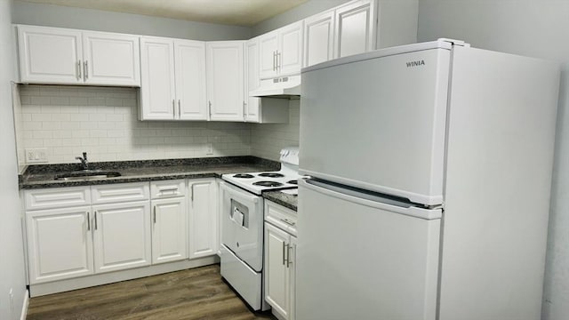 137 Winthrop St Unit 14A, Framingham, MA 01702 - kitchen featuring white appliances, under cabinet range hood, a sink, dark countertops, and white cabinetry