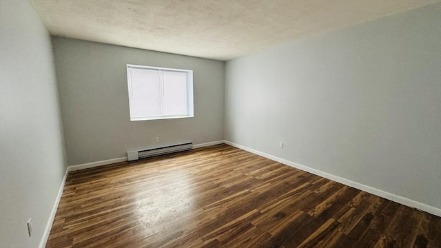 137 Winthrop St Unit 14A, Framingham, MA 01702 - unfurnished room with a baseboard heating unit, dark wood finished floors, baseboards, and a textured ceiling