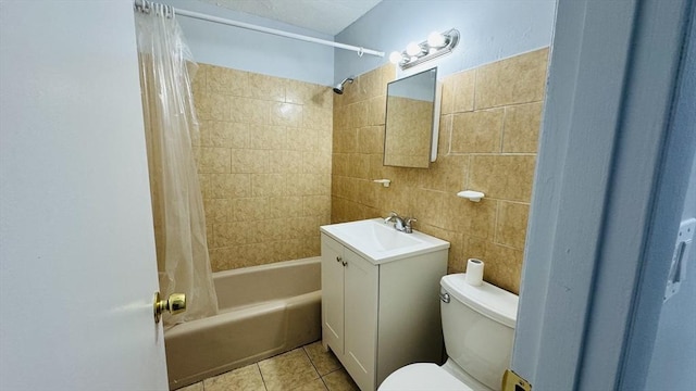 137 Winthrop St Unit 14A, Framingham, MA 01702 - bathroom with tile walls, toilet, shower / bathtub combination with curtain, vanity, and tile patterned floors