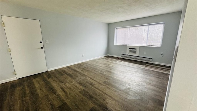 137 Winthrop St Unit 14A, Framingham, MA 01702 - unfurnished room with a baseboard heating unit, wood finished floors, baseboards, and an AC wall unit