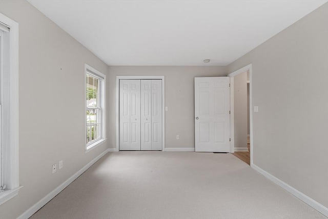 5 Sheffield Way Unit 65, Westborough, MA 01581 - unfurnished bedroom featuring baseboards, carpet floors, and a closet