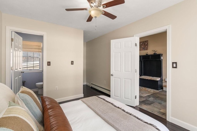 bedroom with a baseboard radiator, dark wood-style flooring, baseboards, and ensuite bath