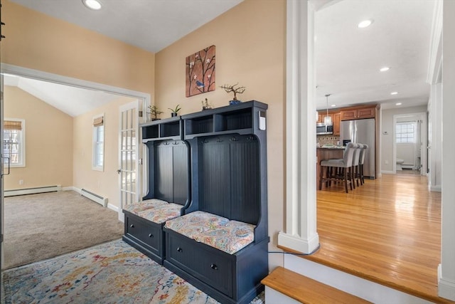 mudroom featuring a baseboard heating unit, recessed lighting, and baseboards