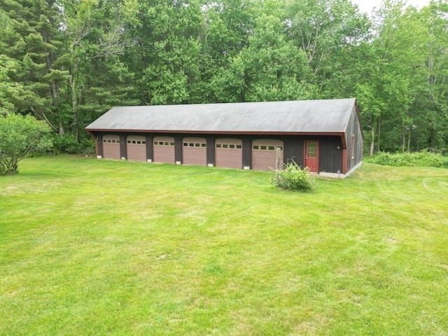 garage featuring a yard