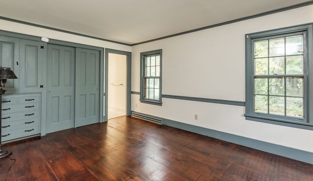 unfurnished bedroom featuring dark hardwood / wood-style flooring