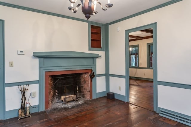 unfurnished living room with crown molding, a brick fireplace, dark hardwood / wood-style floors, and a chandelier