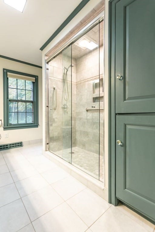 bathroom featuring tile patterned floors and an enclosed shower