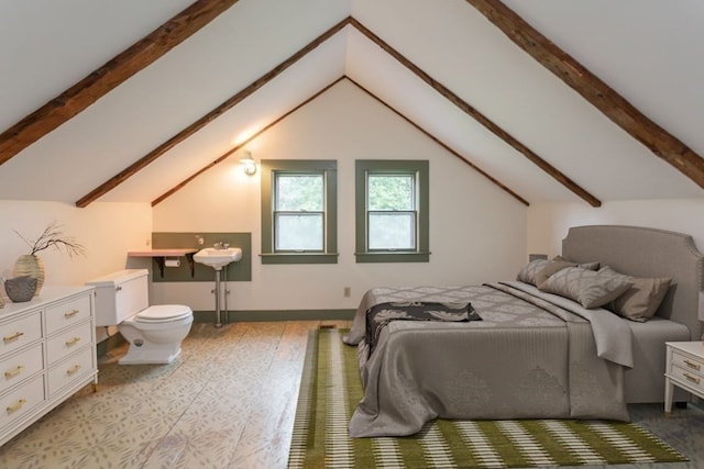 bedroom with vaulted ceiling with beams and light hardwood / wood-style floors