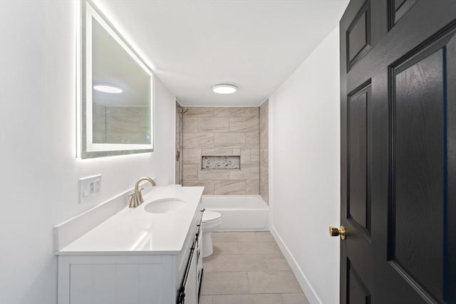 full bathroom featuring tile patterned floors, tiled shower / bath combo, vanity, and toilet