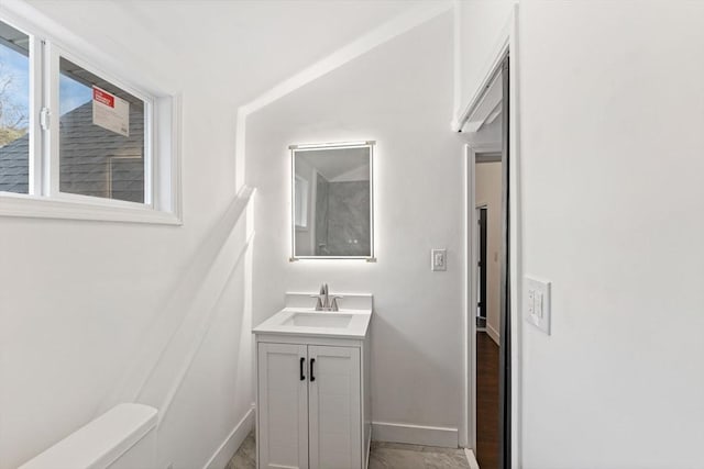 bathroom with toilet and vanity