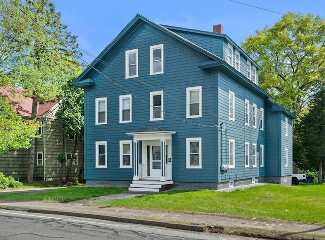 84 Tremont St, Taunton, MA 02780 - view of front of home featuring a chimney and a front yard