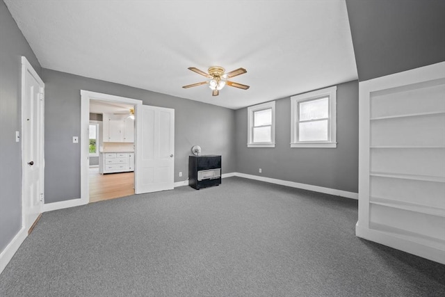 84 Tremont St, Taunton, MA 02780 - unfurnished living room with a ceiling fan, carpet flooring, and baseboards