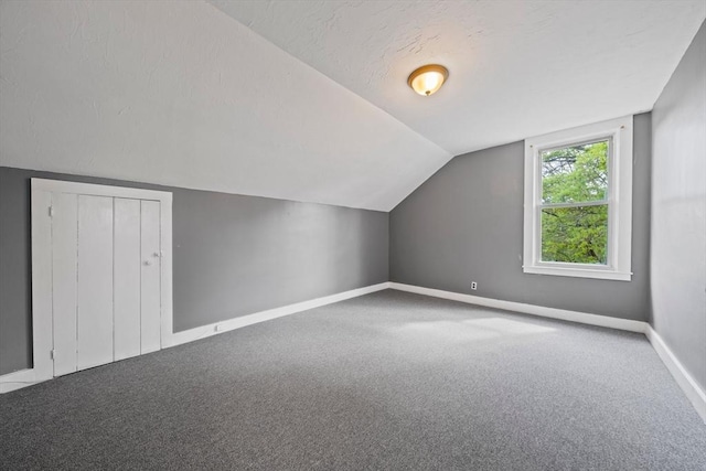 84 Tremont St, Taunton, MA 02780 - bonus room featuring carpet floors, vaulted ceiling, and baseboards