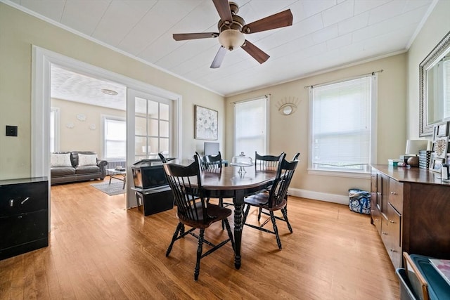 84 Tremont St, Taunton, MA 02780 - dining room with ornamental molding, light wood-style floors, a ceiling fan, and baseboards