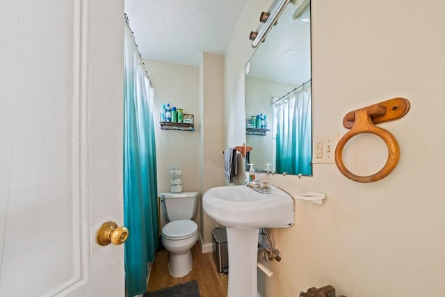 84 Tremont St, Taunton, MA 02780 - bathroom featuring toilet, wood finished floors, and curtained shower