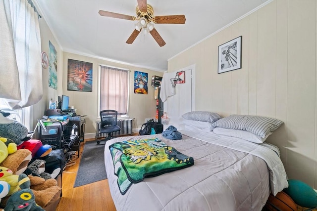 84 Tremont St, Taunton, MA 02780 - bedroom featuring wood finished floors, crown molding, radiator heating unit, and a ceiling fan