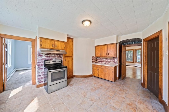 84 Tremont St, Taunton, MA 02780 - kitchen featuring stainless steel range with electric cooktop, under cabinet range hood, brown cabinetry, and decorative backsplash
