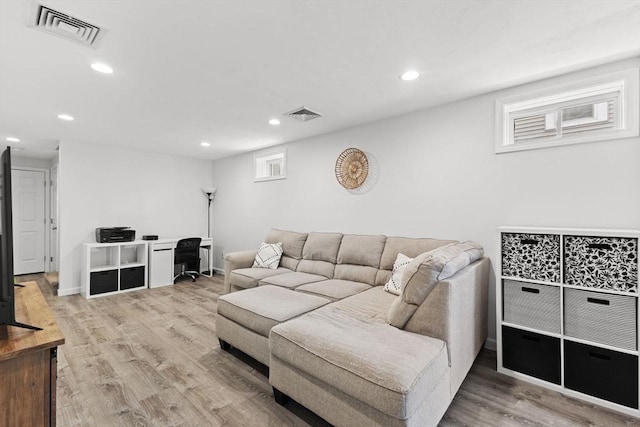 189 Progresso Ave, Woonsocket, RI 02895 - living room featuring light wood-style flooring, recessed lighting, and plenty of natural light