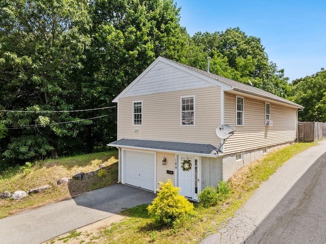 189 Progresso Ave, Woonsocket, RI 02895 - view of front of property featuring asphalt driveway and an attached garage
