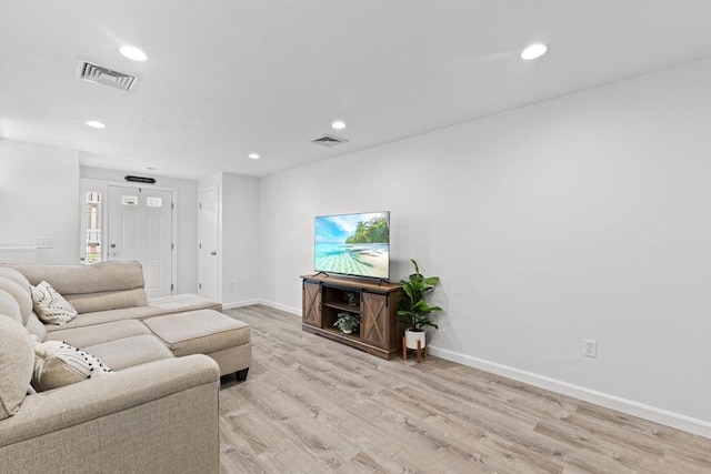 189 Progresso Ave, Woonsocket, RI 02895 - living room featuring light wood-style floors and recessed lighting