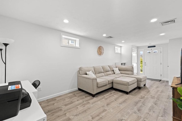 189 Progresso Ave, Woonsocket, RI 02895 - living area featuring light wood finished floors and recessed lighting