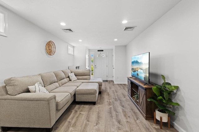 189 Progresso Ave, Woonsocket, RI 02895 - living area with light wood-style flooring and recessed lighting