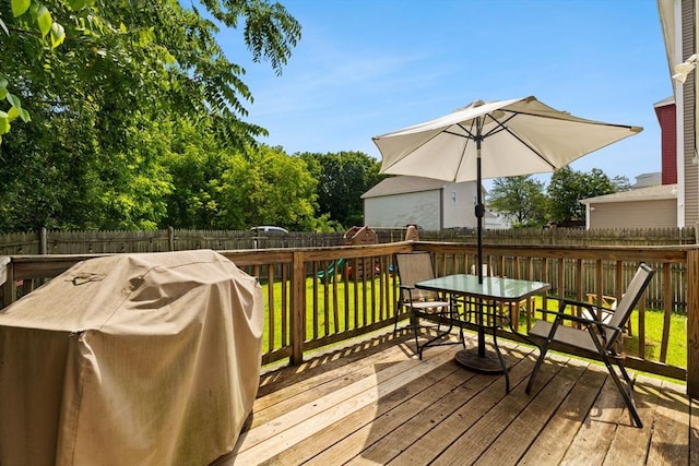 189 Progresso Ave, Woonsocket, RI 02895 - deck featuring a grill, a fenced backyard, and outdoor dining space