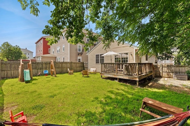 189 Progresso Ave, Woonsocket, RI 02895 - fenced backyard with a playground and a deck