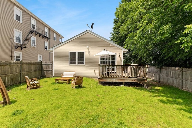 189 Progresso Ave, Woonsocket, RI 02895 - rear view of house with a wooden deck and a fenced backyard