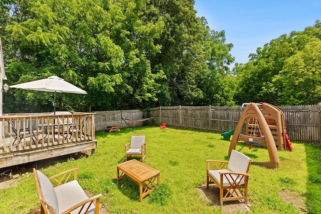 189 Progresso Ave, Woonsocket, RI 02895 - fenced backyard with a wooden deck and a playground