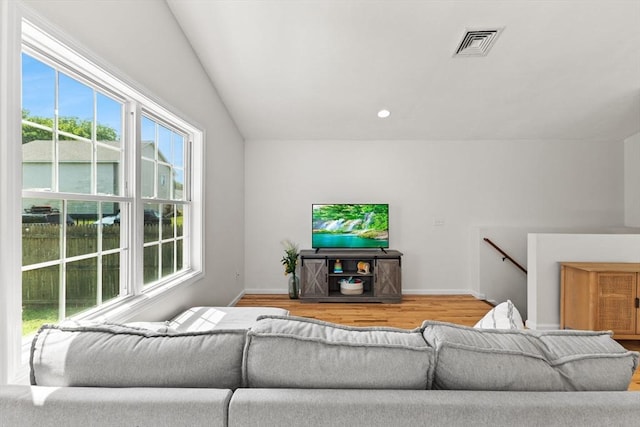 189 Progresso Ave, Woonsocket, RI 02895 - living room featuring wood finished floors, plenty of natural light, and lofted ceiling