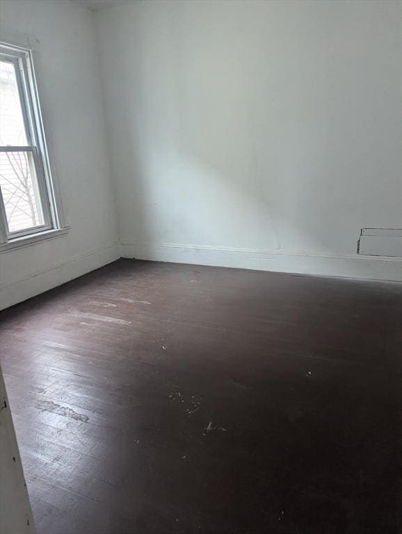 21 Mclellan St, Boston, MA 02121 - spare room with baseboards and wood finished floors
